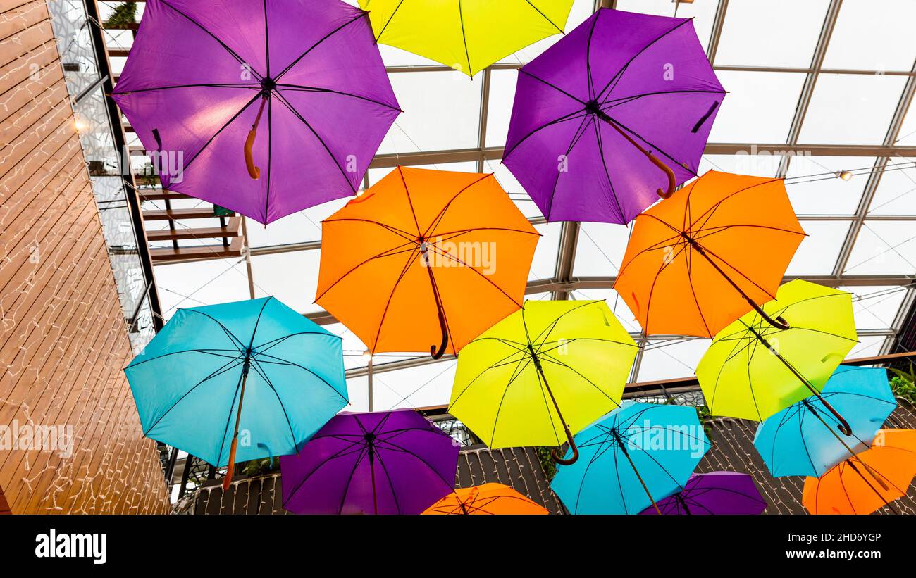 Multiple colorful umbrellas. Fashion and accesories concept. Stock Photo