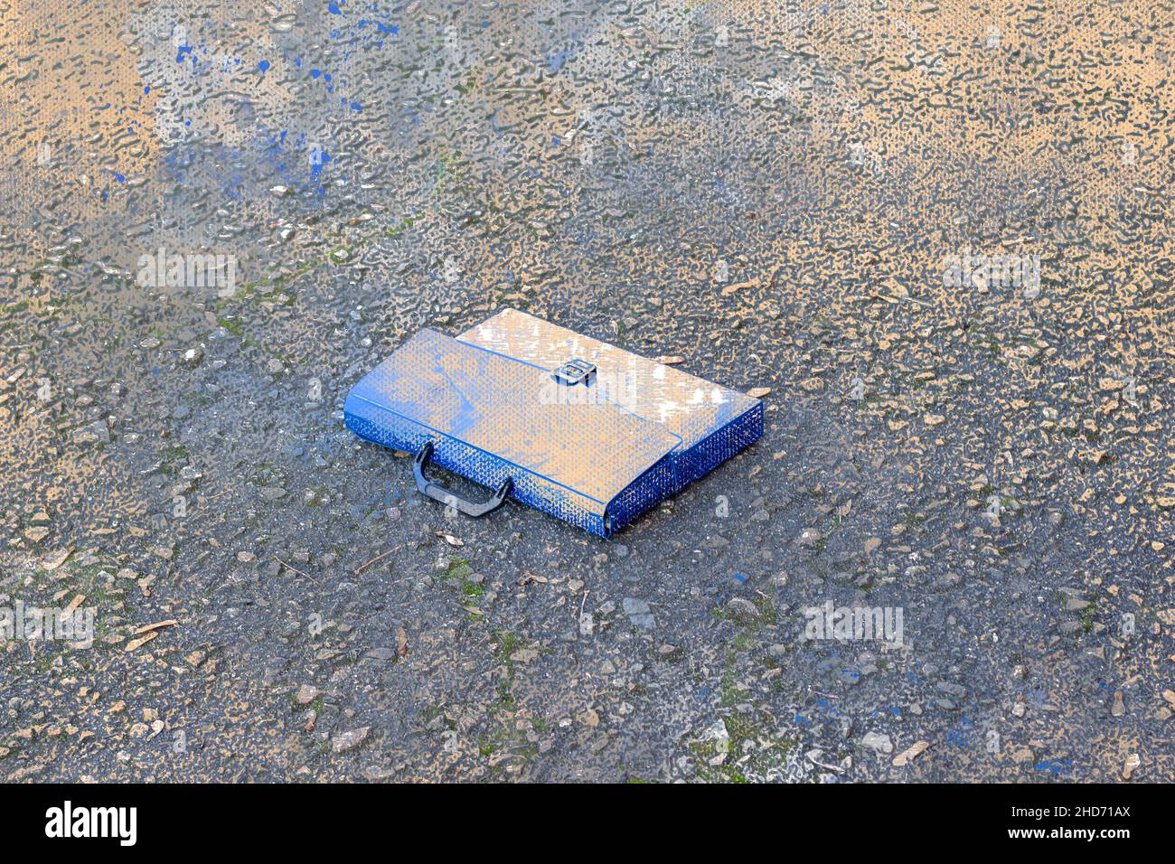 Blue lost document case on asphalt. Digital watercolor painting. Stock Photo