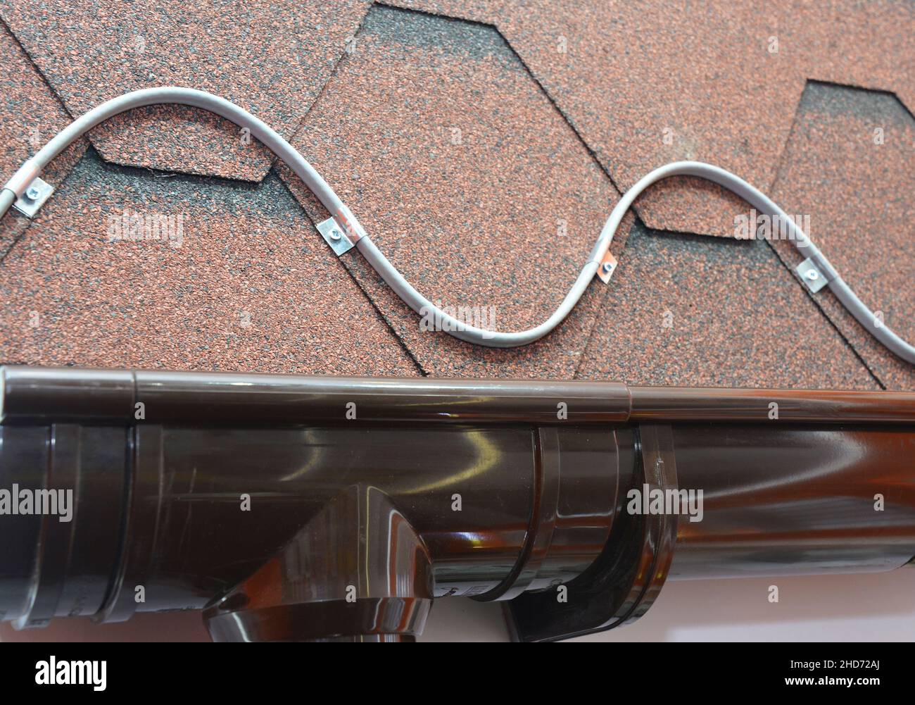 Roofing heating cable for ice and snow melting. A closeup on a roofing