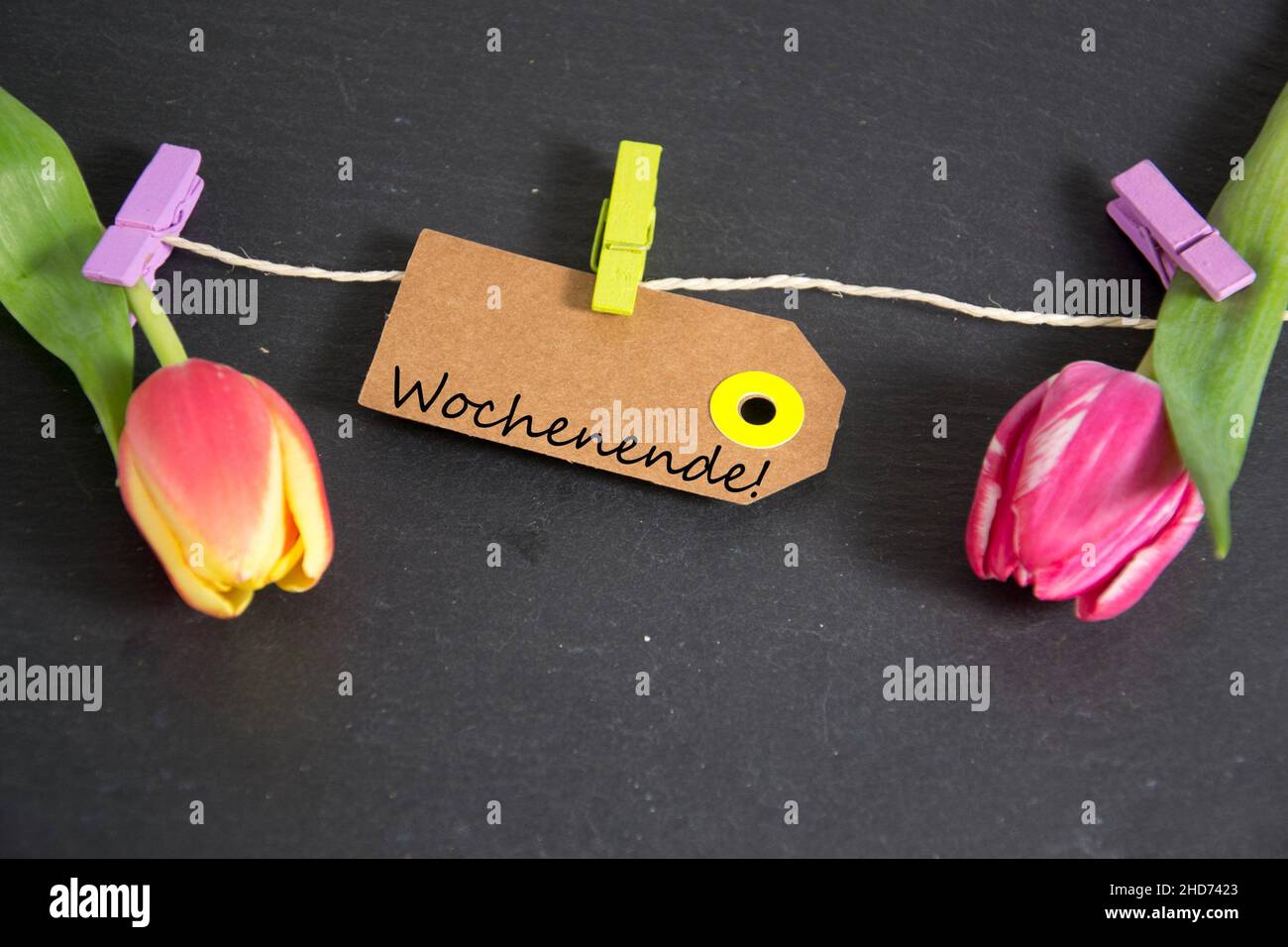 Wochenende inscription written on paper tag. Stock Photo