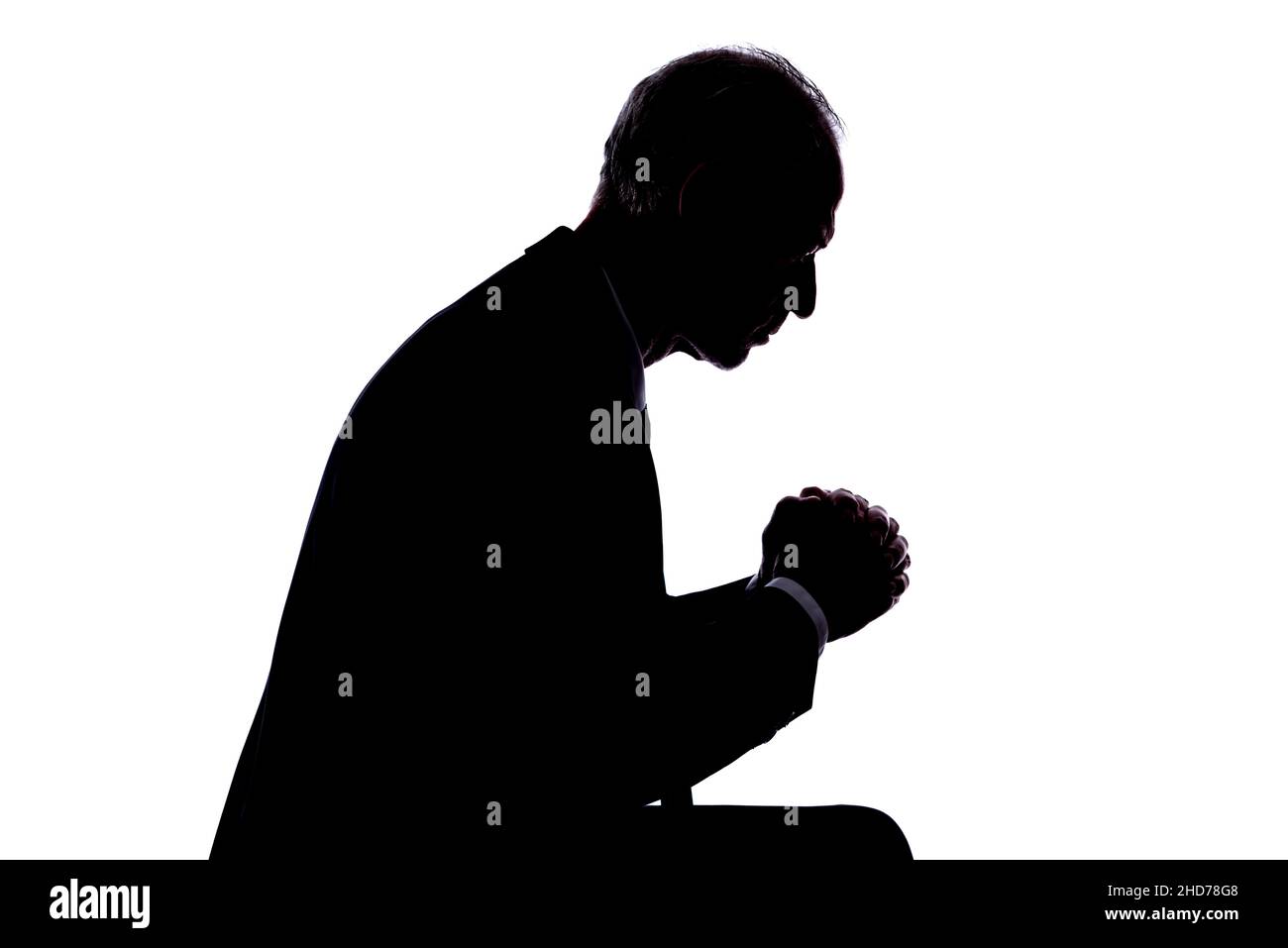 Silhouette man expressing prayer hi-res stock photography and images ...