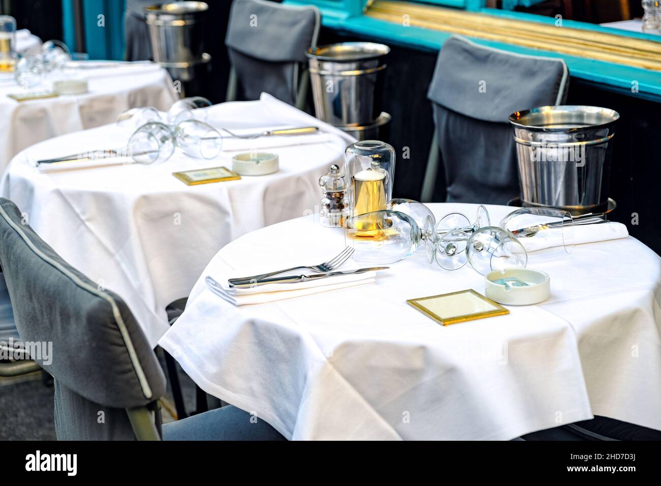 french restaurant - tables and chairs on the street - Paris, France Stock Photo