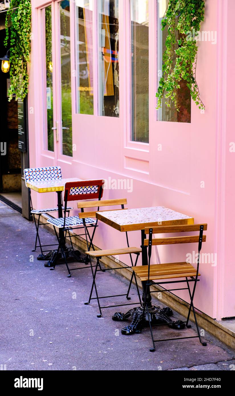 small french restaurant - tables and chairs on the street - Paris, France Stock Photo
