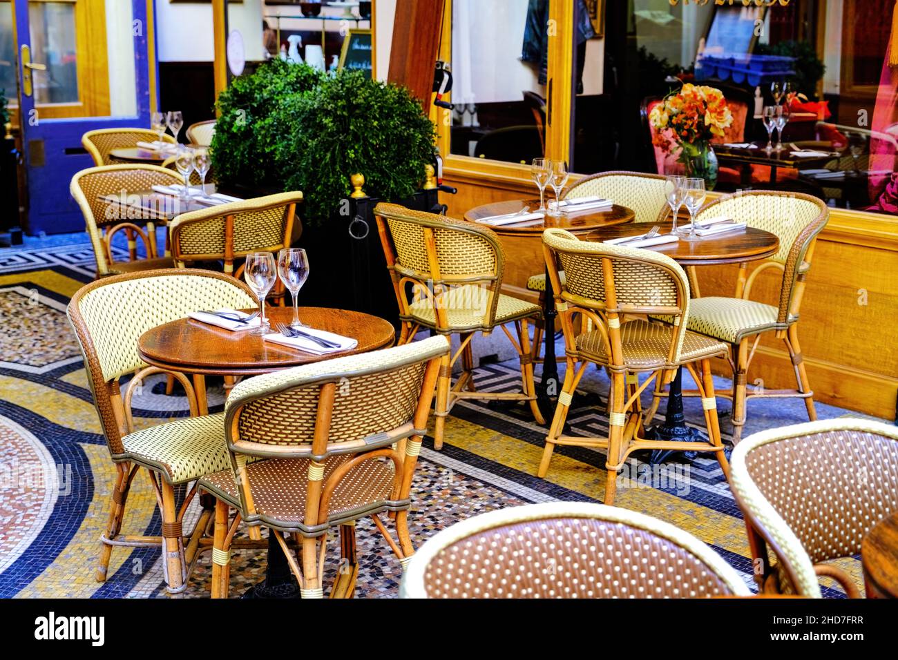 french restaurant - tables and chairs on the patio - Paris, France Stock Photo