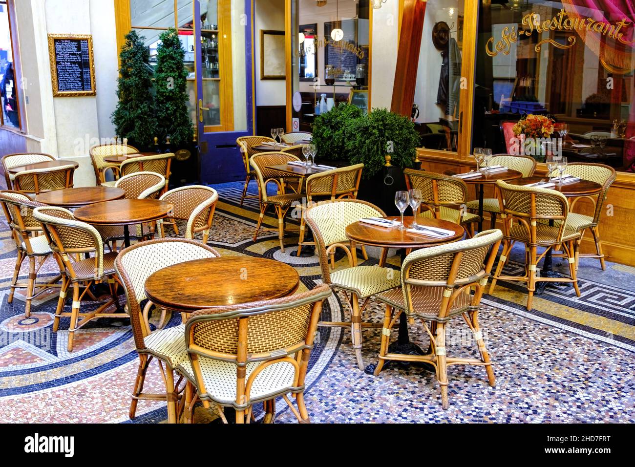 french restaurant - tables and chairs on the patio - Paris, France Stock Photo