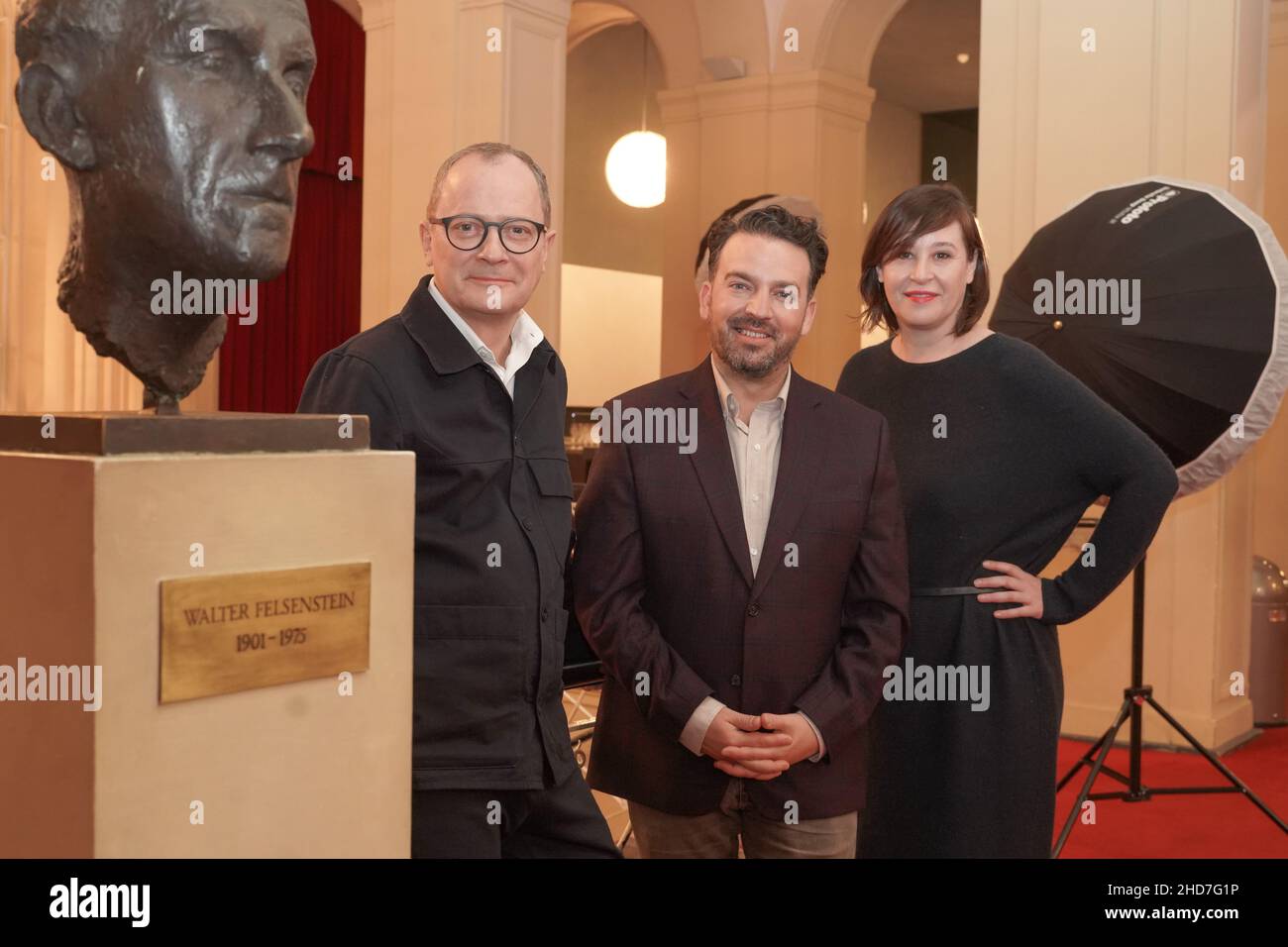 04 January 2022, Berlin: Philip Bröking (l), Opera Director and designated Co-Director, and Susanne Moser (r), Executive Director and designated Co-Director, introduce James Gaffigan as the new General Music Director of the Komische Oper. Gaffigan will assume his new role at the beginning of the 2023/24 season. Photo: Jörg Carstensen/dpa Stock Photo