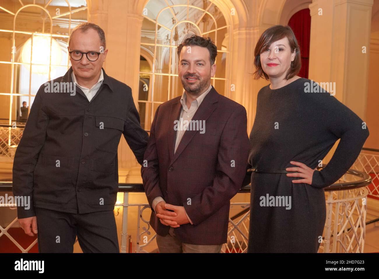 04 January 2022, Berlin: Philip Bröking (l), Opera Director and designated Co-Director, and Susanne Moser (r), Executive Director and designated Co-Director, introduce James Gaffigan as the new General Music Director of the Komische Oper. Gaffigan will assume his new role at the beginning of the 2023/24 season. Photo: Jörg Carstensen/dpa Stock Photo