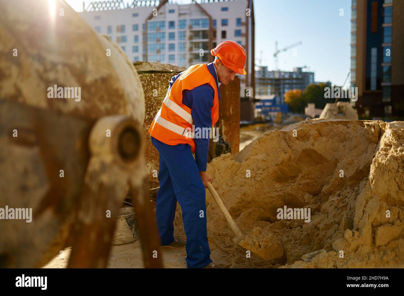 Male worker making concrete at construction site Stock Photo