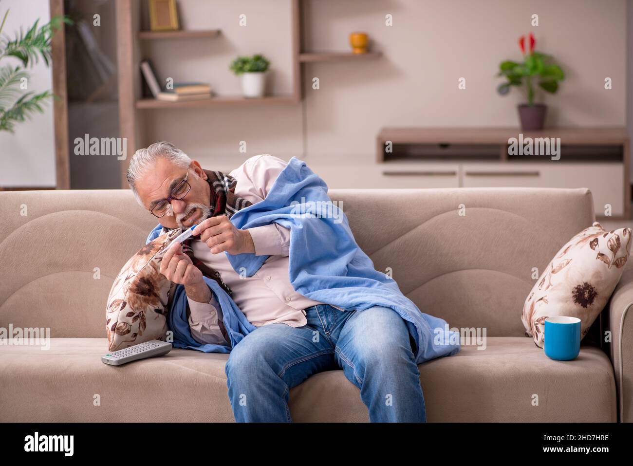 Sick old man coughing sitting hi-res stock photography and images - Alamy