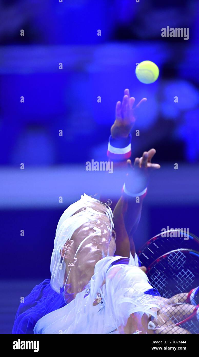 Multi exposure photo of a Tennis player at the Next Gen ATP Finals at the indoor tennis court of the Allianz Cloud, in Milan 2021. Stock Photo