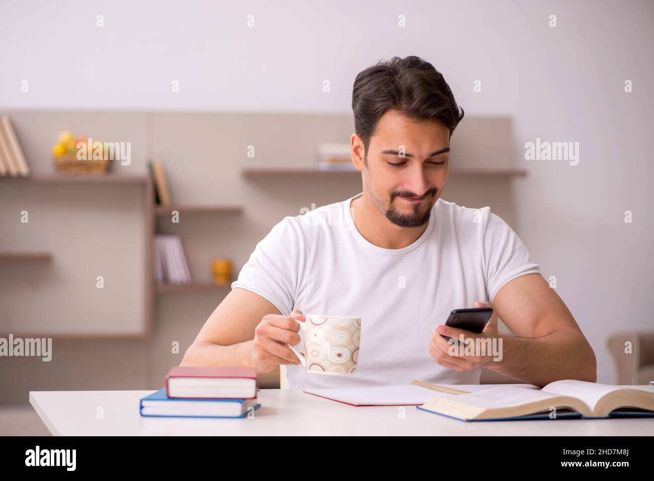 Young student studying at home during pandemic Stock Photo - Alamy