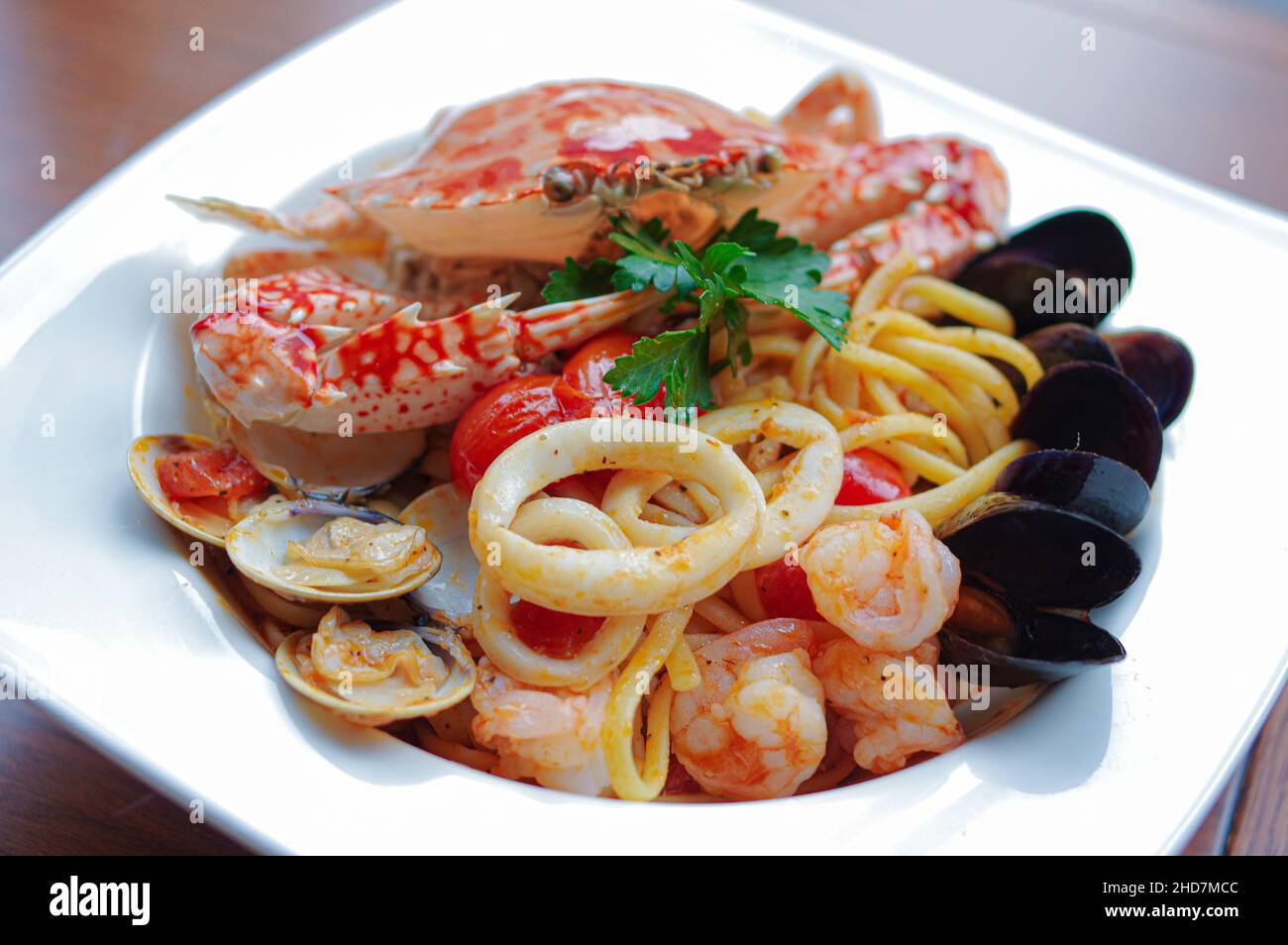 Seafood spaghetti with squid crab shrimp clam tomato sauce and mussel Stock Photo Alamy