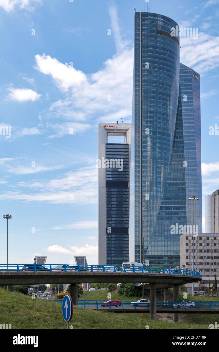 Madrid, Spain - June 07 2018: The Cuatro Torres Business Area with the Torre Espacio, Torre de Cristal and Torre Cepsa as well as the top of the Twin Stock Photo