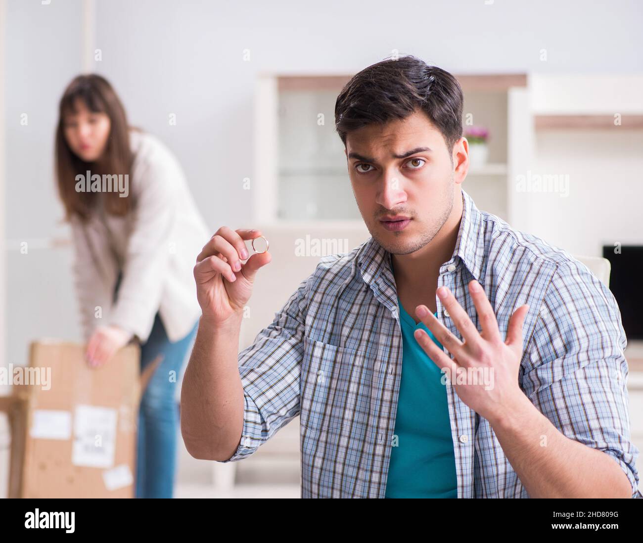 The woman evicting man from house during family conflict Stock Photo ...