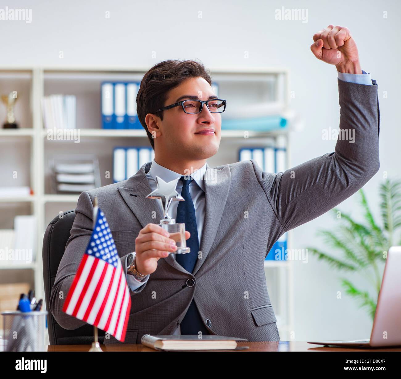 The businessman with american flag in office Stock Photo - Alamy