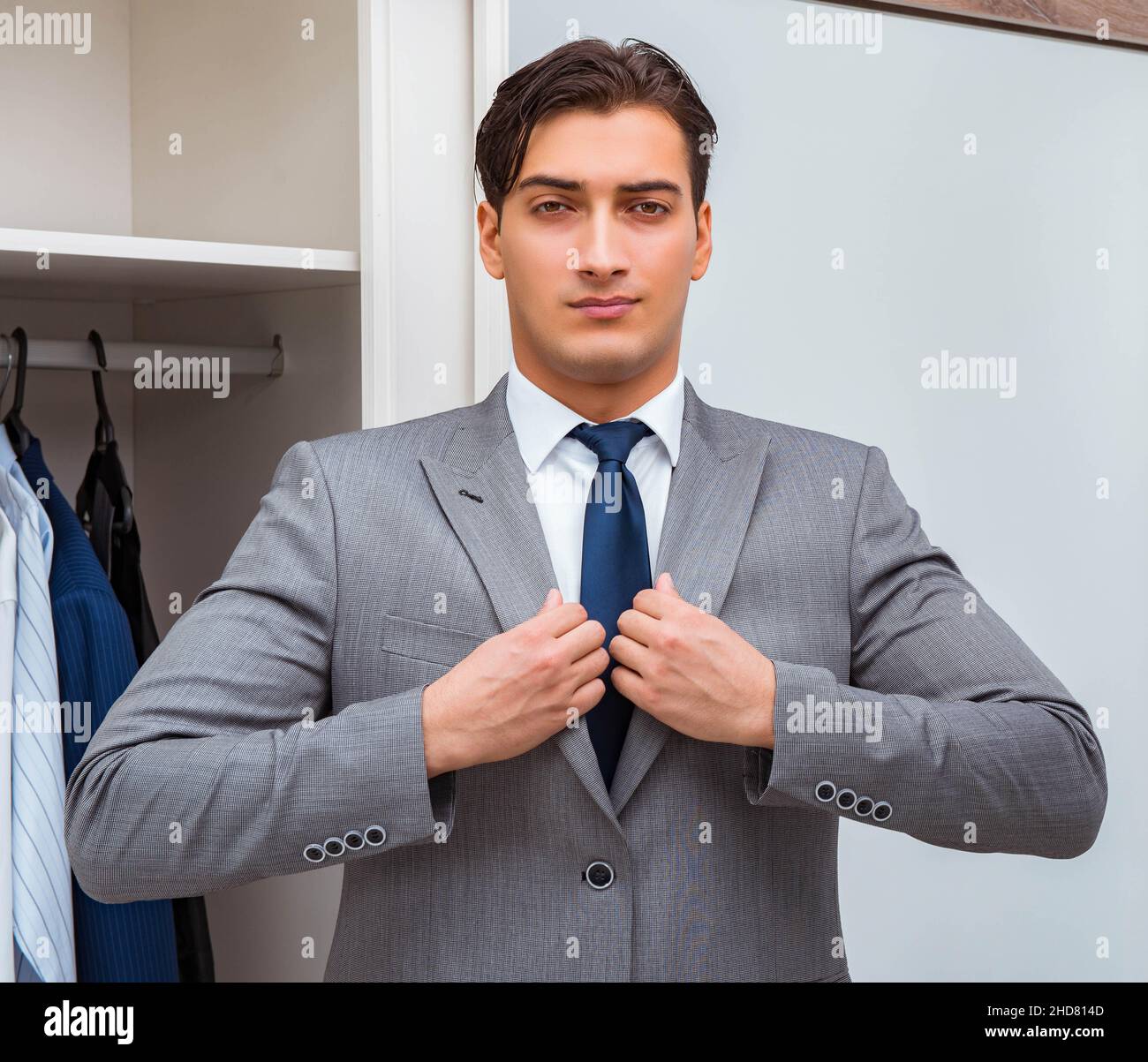 The businessman dressing up for work Stock Photo - Alamy