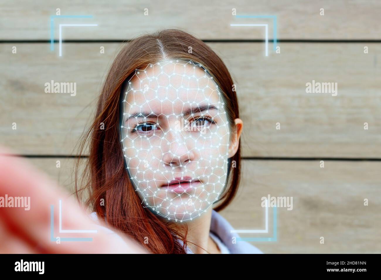 Young woman face during ai authentication biometrics. Stock Photo