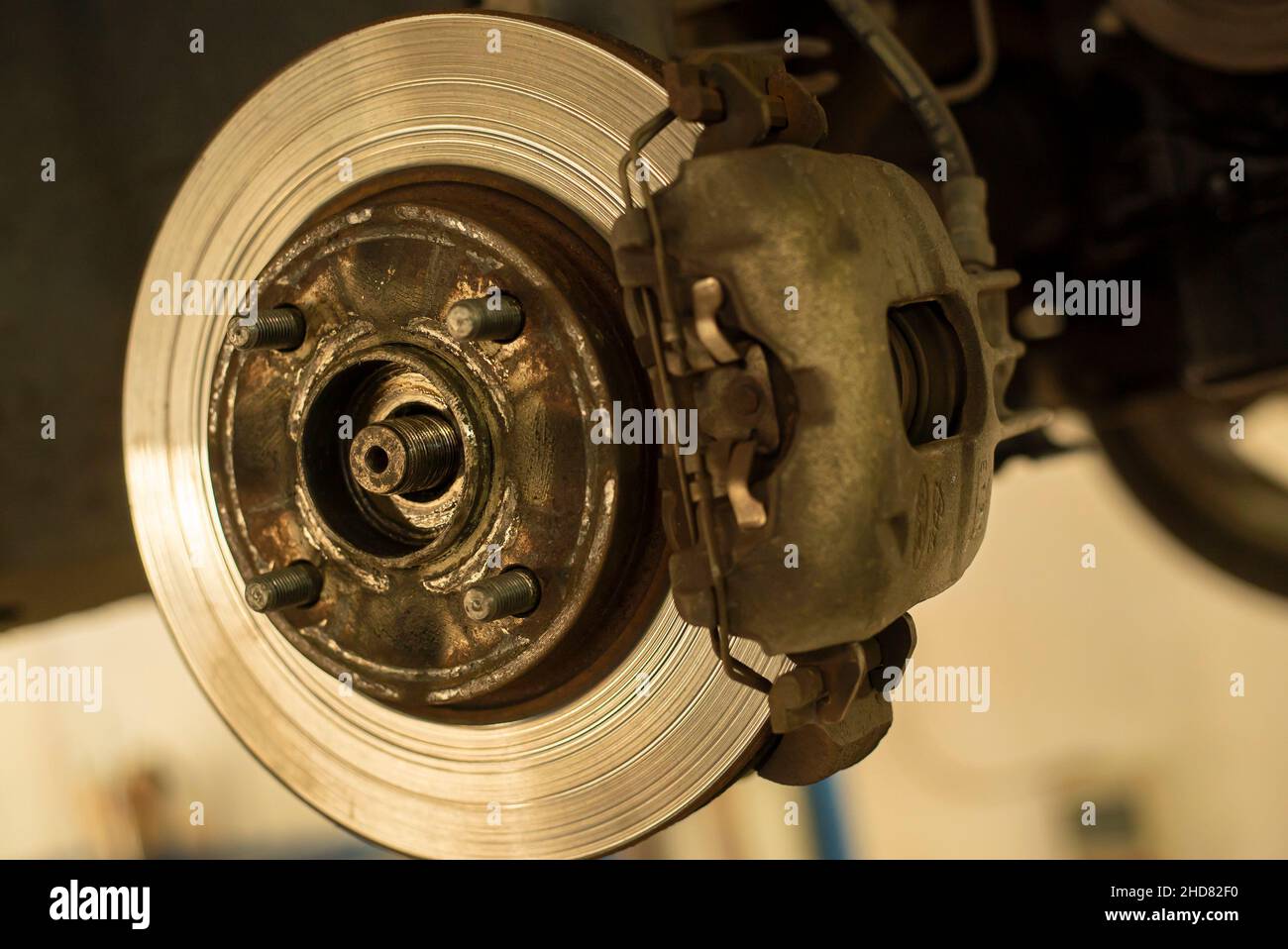 Detail of a worn disc brake ready for replacement and maintenance Stock Photo