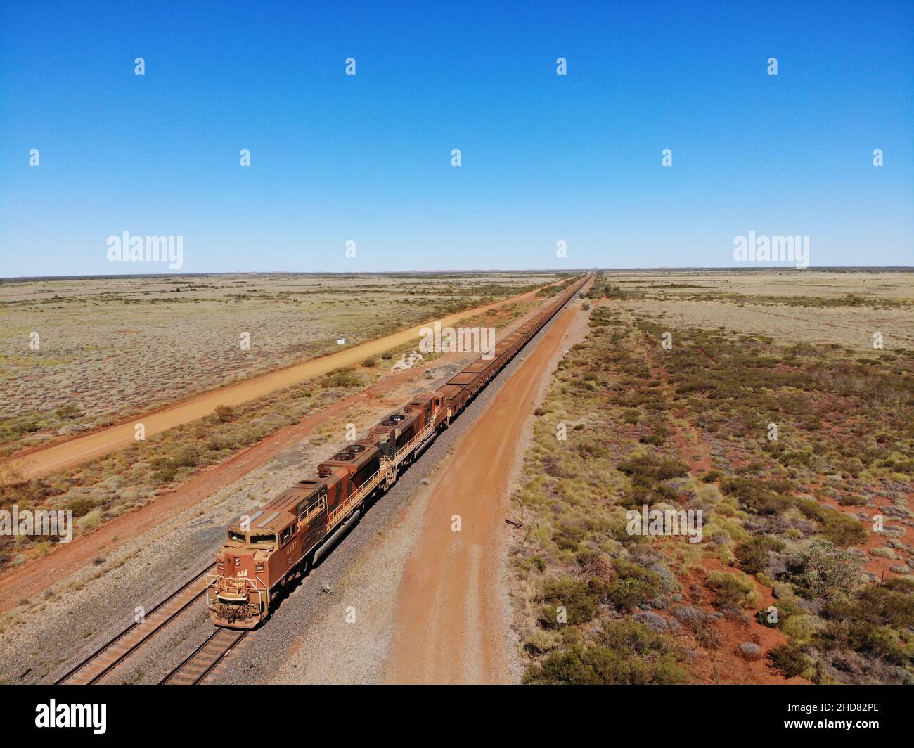 Created by dji camera, a Iron Ore Train in the Pilbara near to Port Hedland on Fortescue Railway Stock Photo