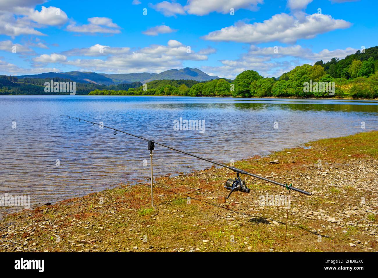 Fishing rod setup at the water's edge, Loch Venacher, Trossachs, Scotland Stock Photo