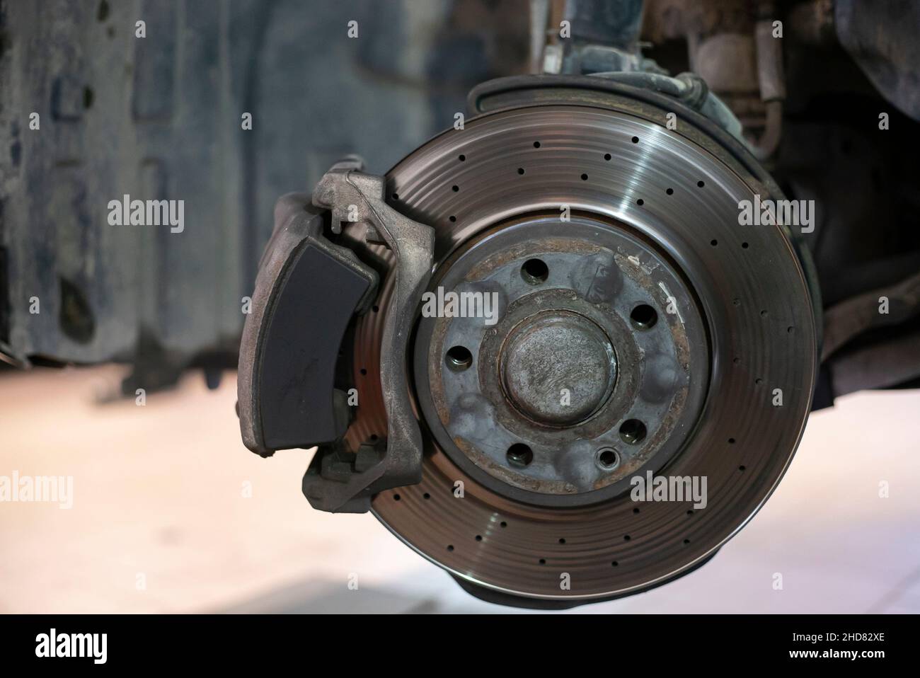 Detail of a worn disc brake ready for replacement and maintenance Stock Photo