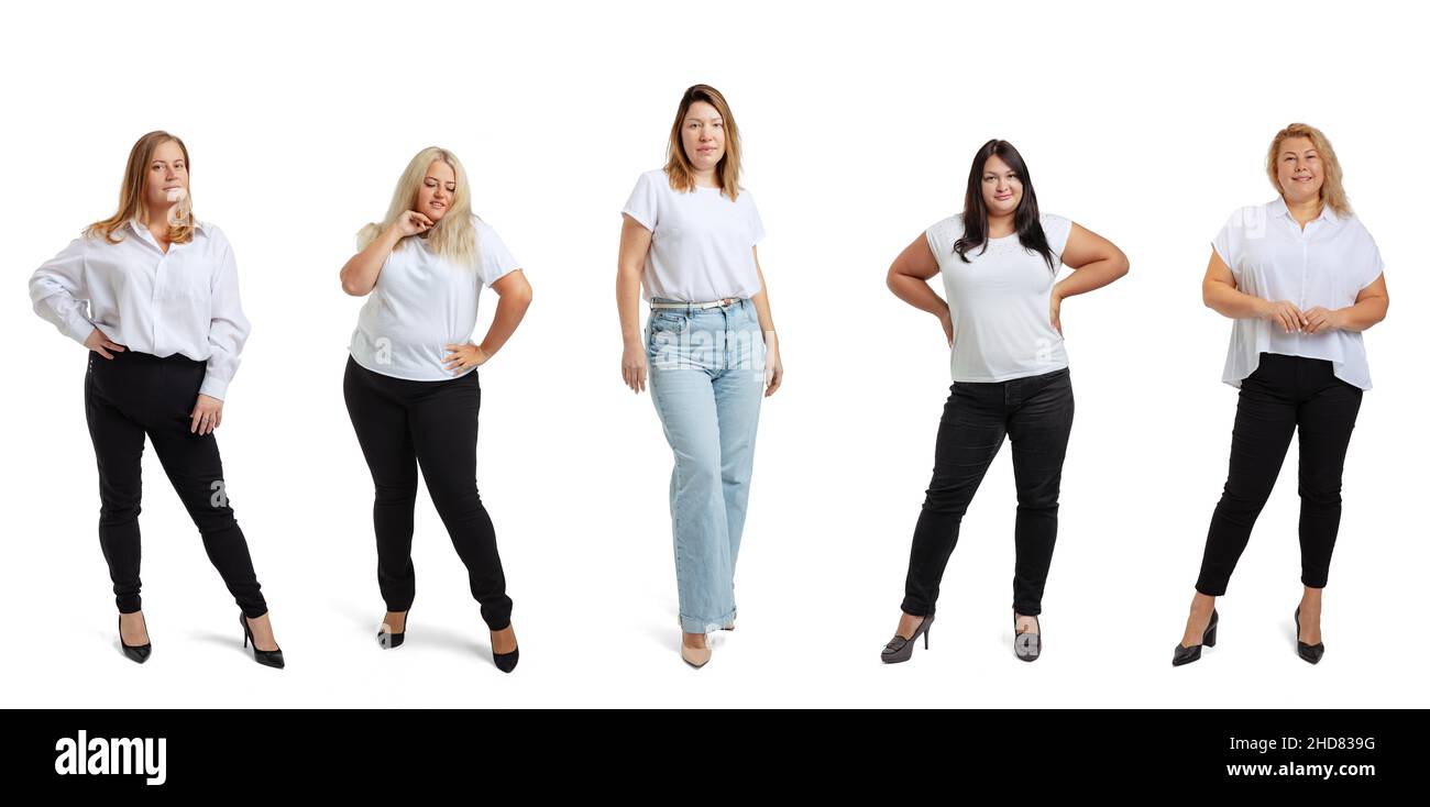 Set of full-length portraits of plus-size women wearing white t-shirt and jeans posing isolated on white studio background. Body positive concept Stock Photo