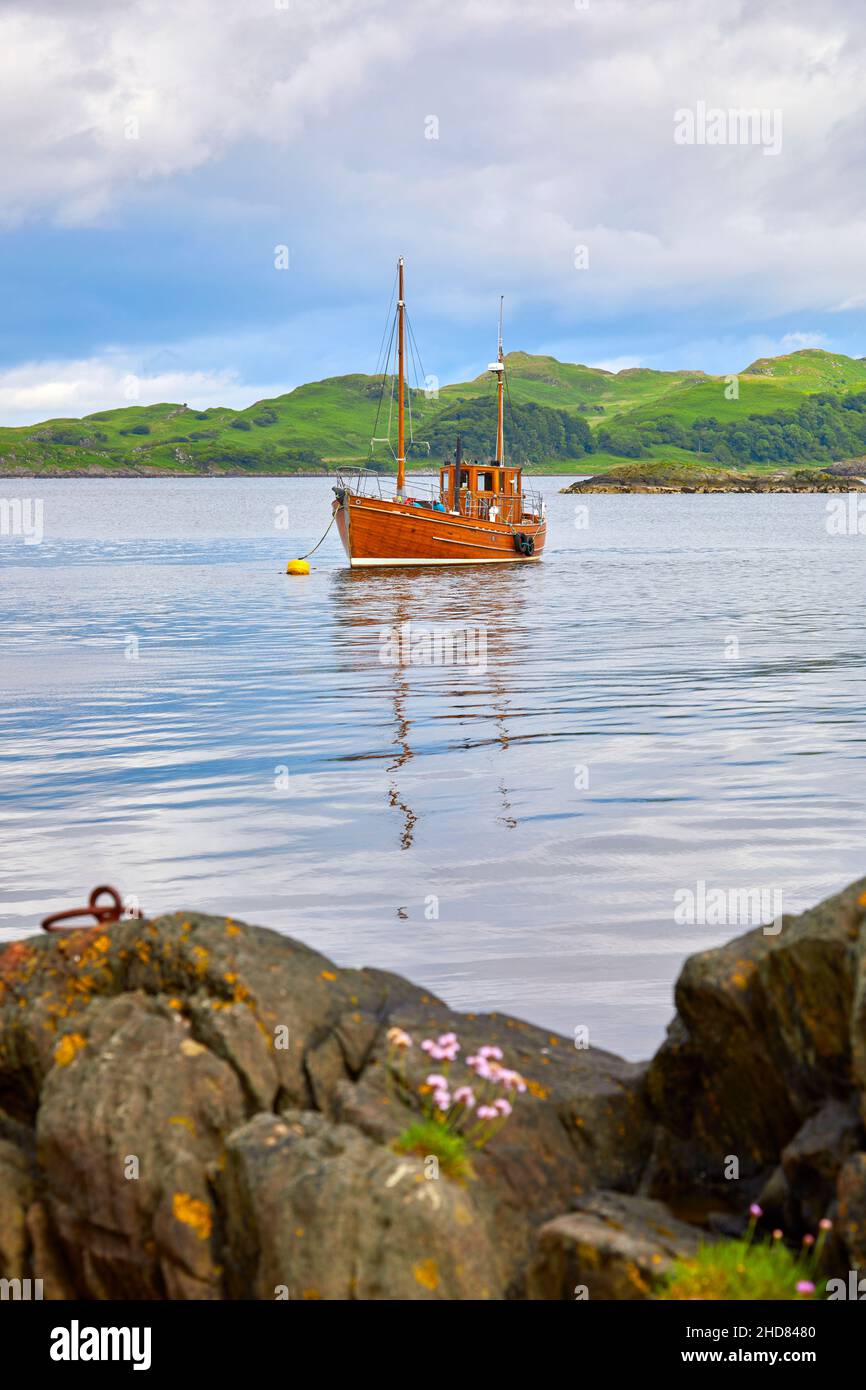 The Sgarbh (gaelic for cormorant, the sea bird) was built in 1947, now a fully restored classic motor boat moored at Crinan Stock Photo