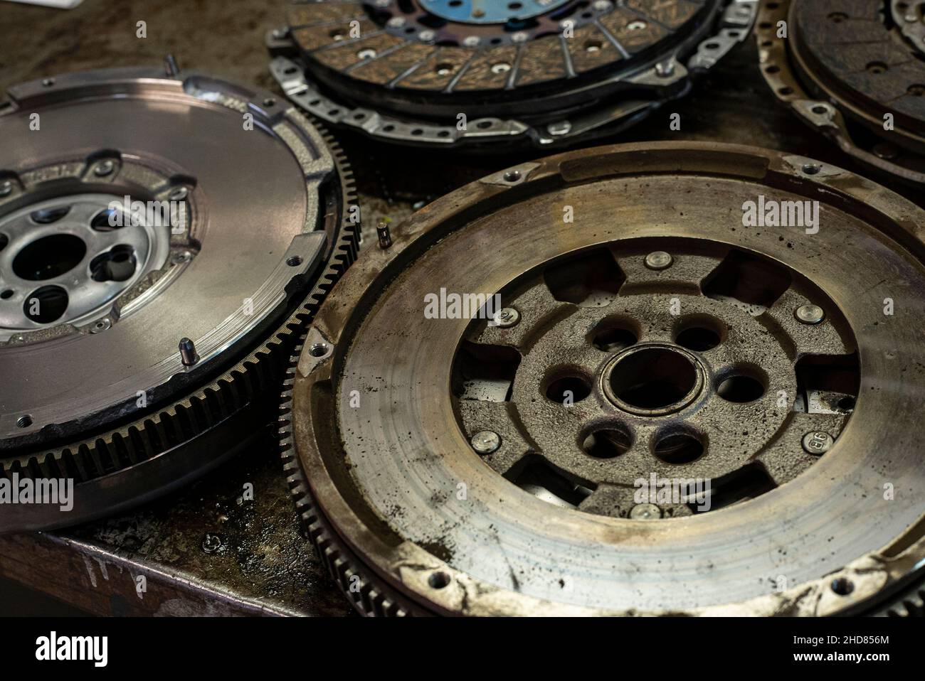 Detail of Car flywheel in a car spare parts old and new Stock