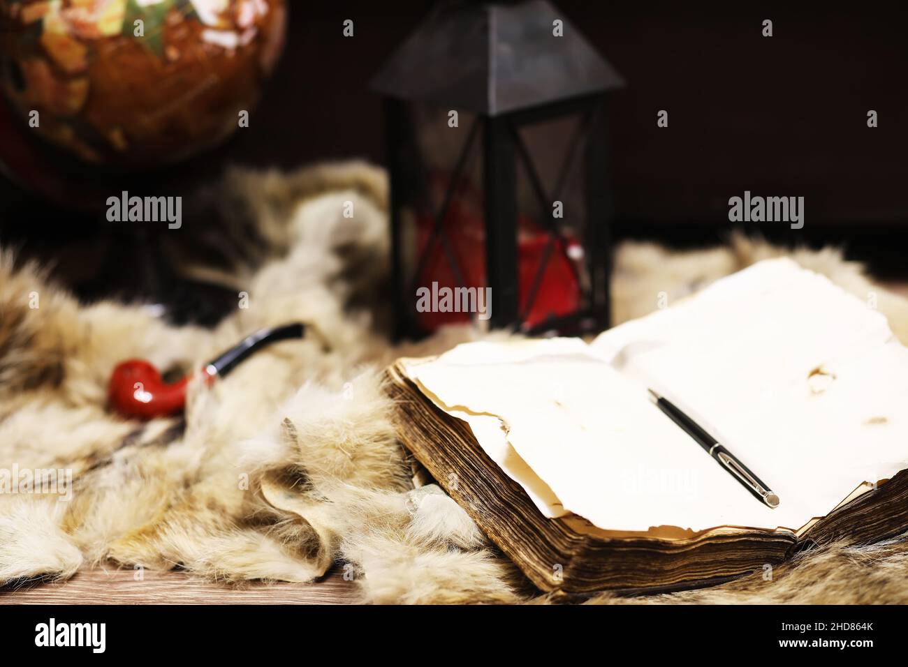 Retro old book and world desk globe fur, learning and education concepts. Stock Photo