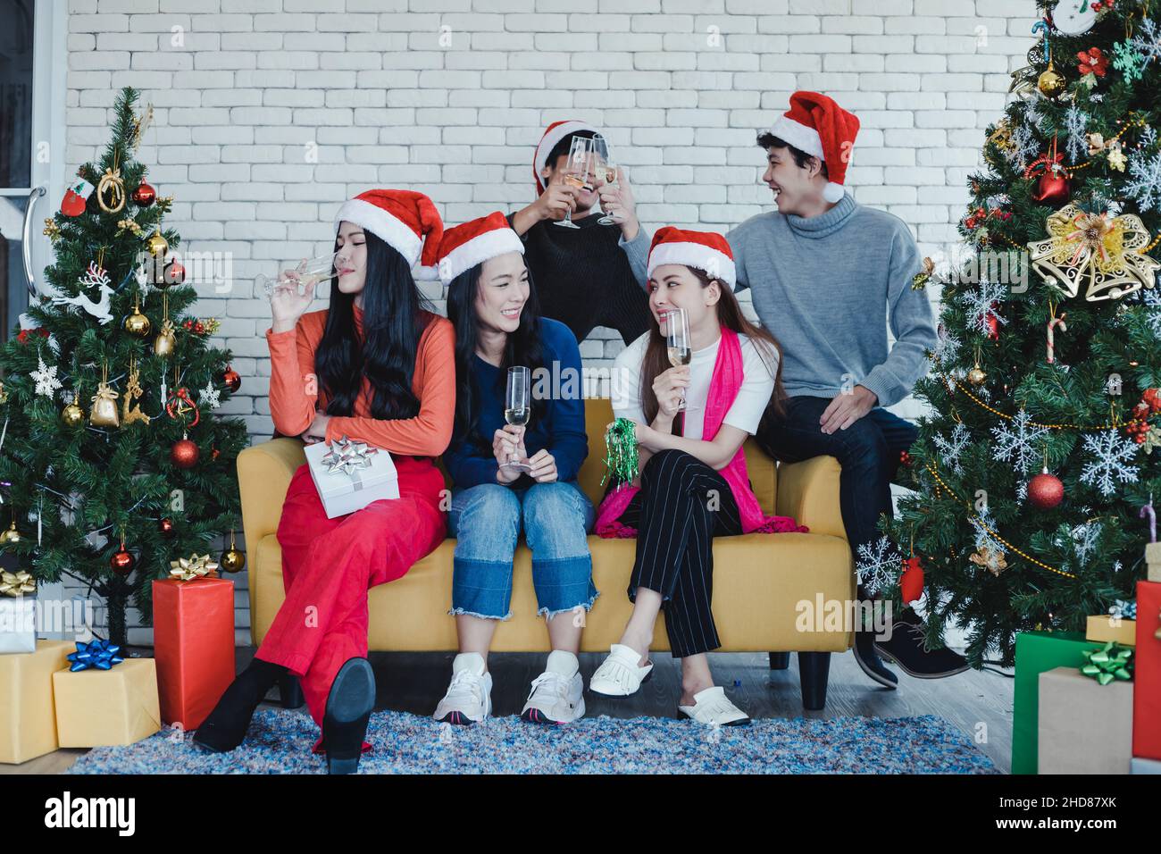 Party of group young Asian with drink and drunk at home in celebrate Christmas festival. Celebration of new year at house. Merry Christmas and happy h Stock Photo