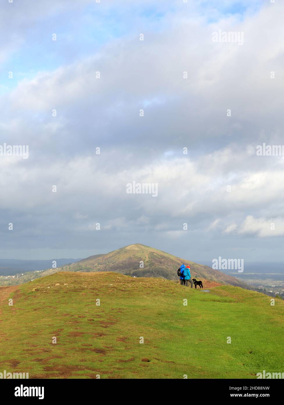 Walkers and Dog enjoying the view from the Malvern hills Stock Photo