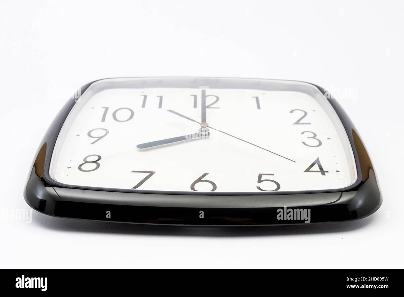 Black classic clock on isolated white background Stock Photo - Alamy