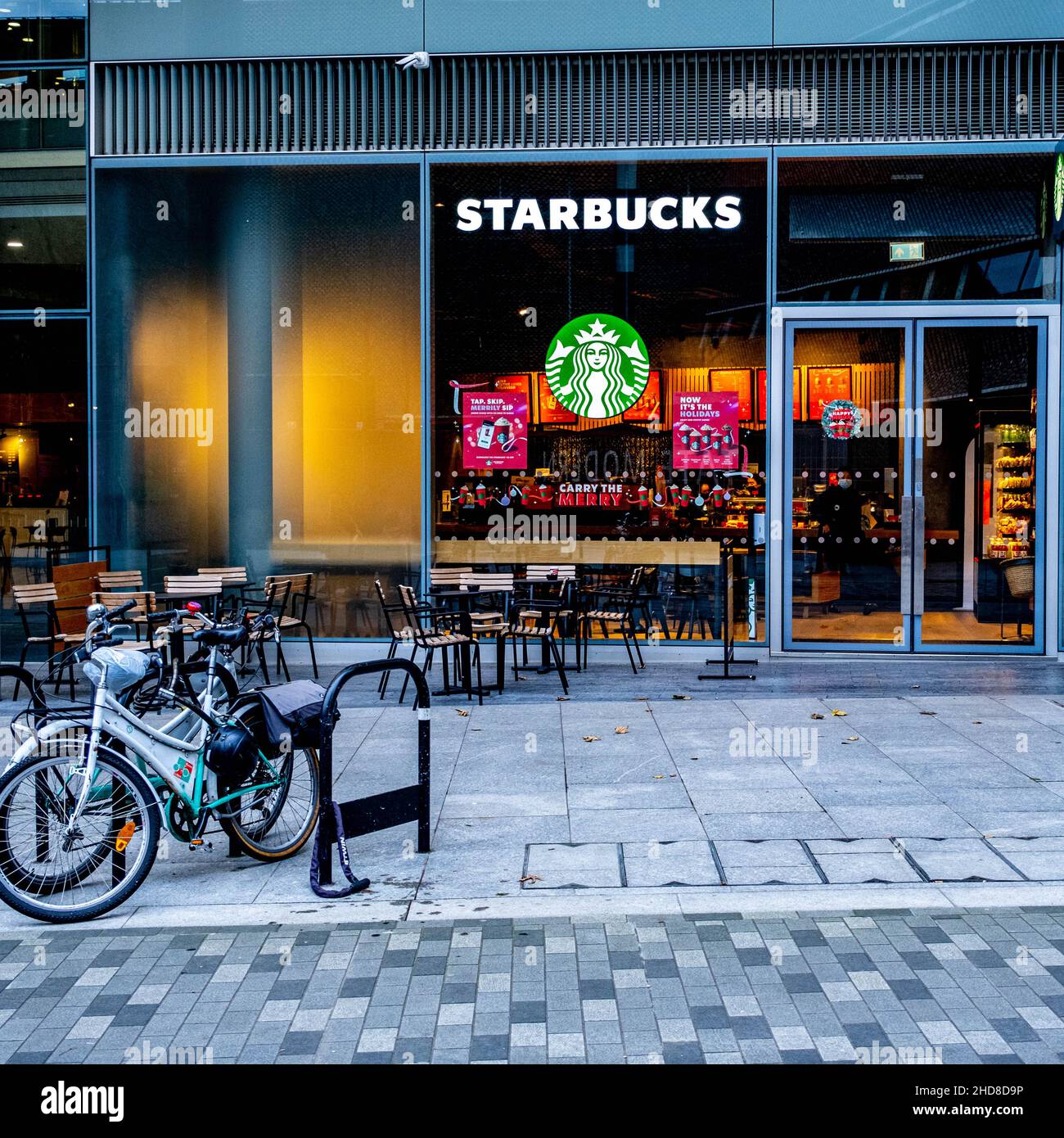London England UK January 02 2022, Starbucks Coffee Shop Southbank London With No People and Parked Bicycles Stock Photo