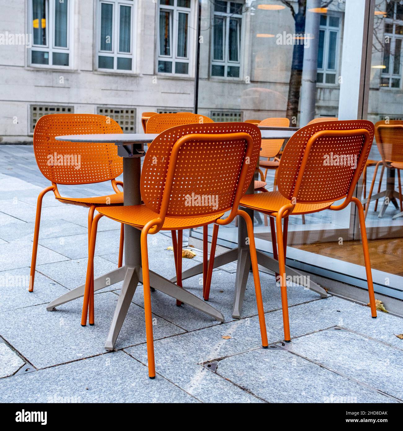 London England UK January 02 2022, Colourful Orange Table And Chairs Outside A Leon Fast Food Restaurant In Southbank London Stock Photo