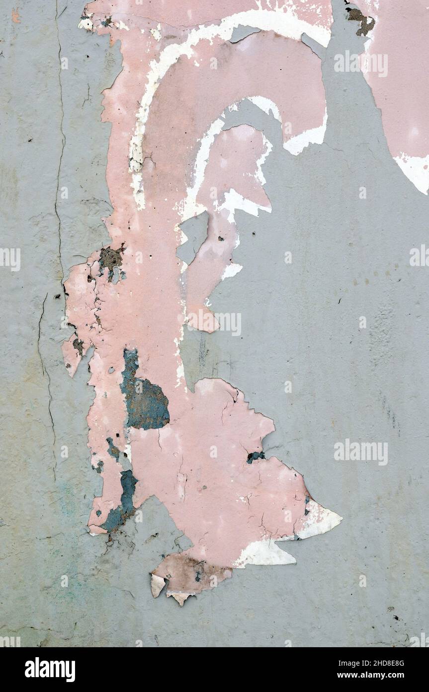 Paint peeling off concrete wall. Suitable as background or texture