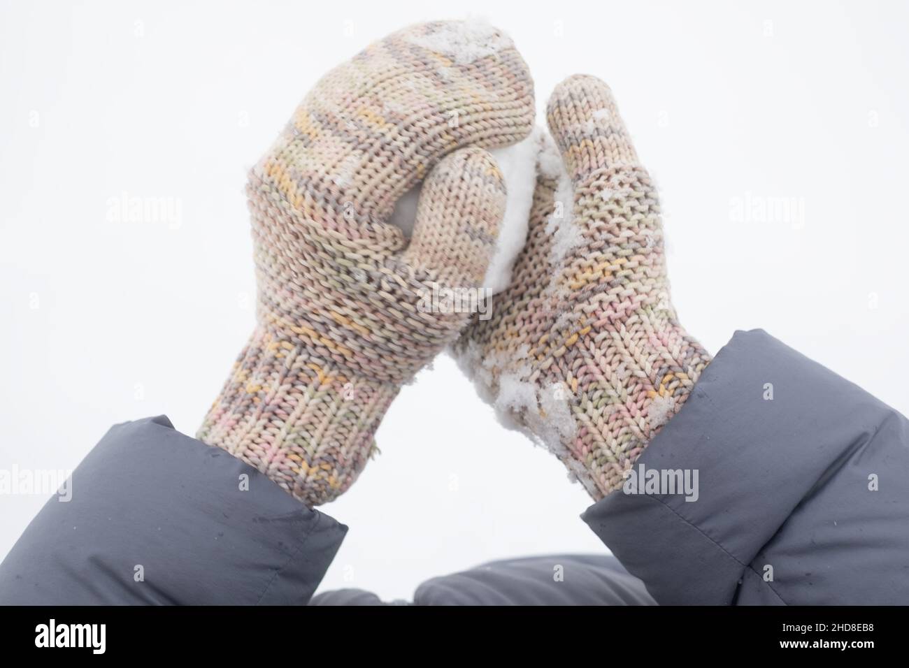 Snowball in the hand of a woman. ready for snow fight Stock Photo