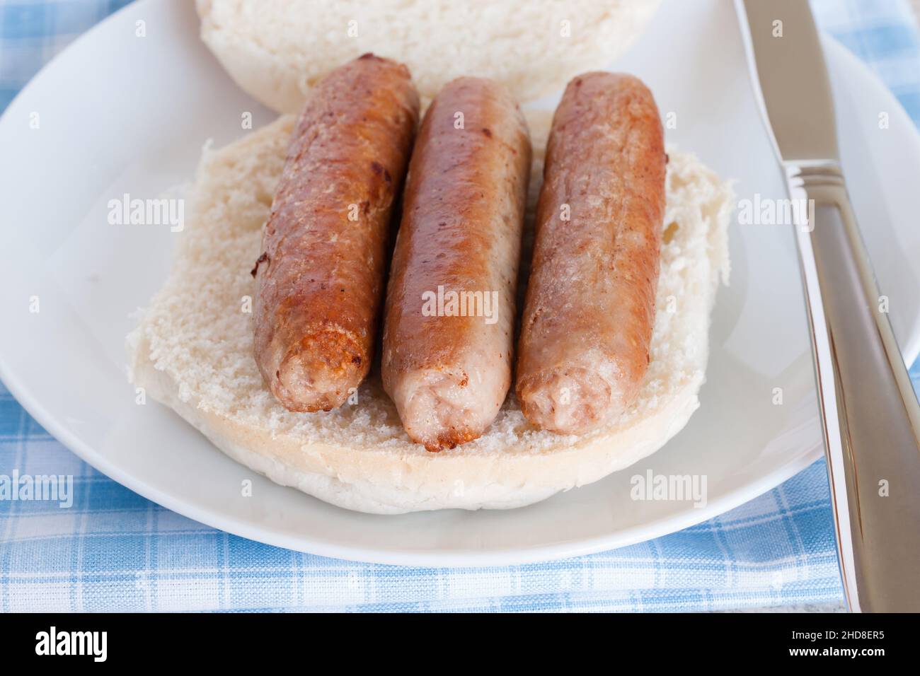 Sausage sandwich or sausage bap a popular British breakfast snack Stock Photo