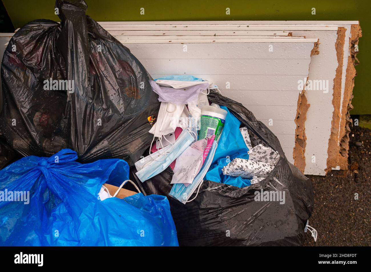 Windsor, Berkshire, UK. 4th January, 2022. Despite waste collection services in Windsor working as normal post the Christmas holidays, some people are still choosing to illegally fly tip their rubbish next to charity collection points. Credit: Maureen McLean/Alamy Stock Photo