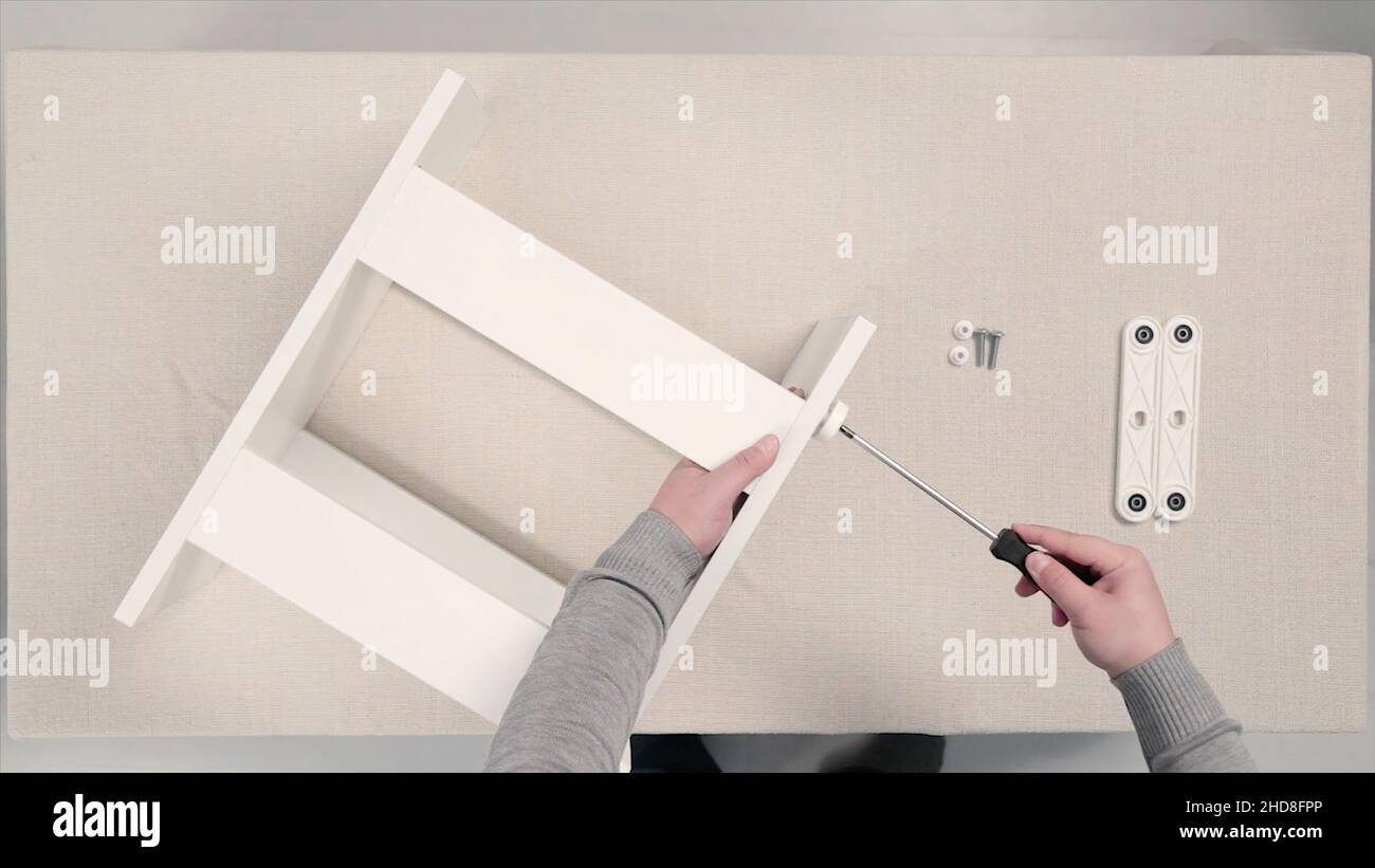 Tools for furniture assembly. Stock. Assembling furniture, hands in ...