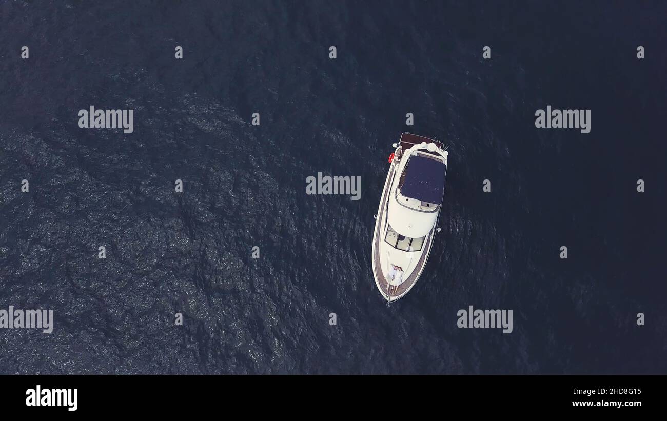 Amazing view to yacht sailing in open sea on a suny day. Aerial top ...