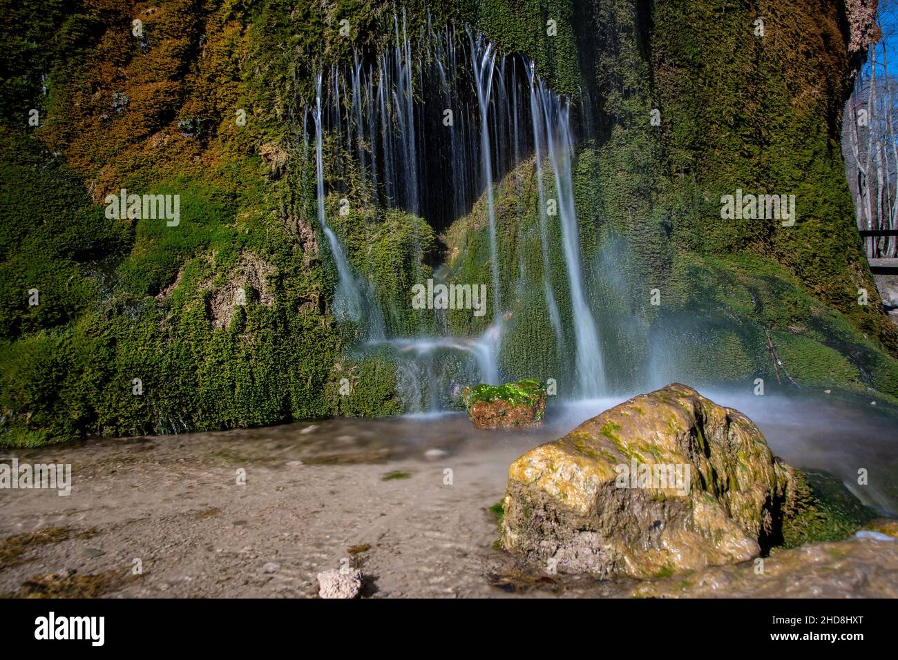 View of the colorful Dreimühlen waterfall in the Eifel Stock Photo