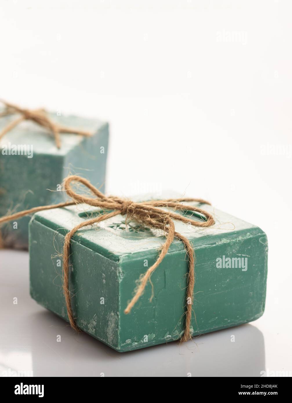 Shower eco refresh concept. Handmade soap bars tied with rope isolated on white background