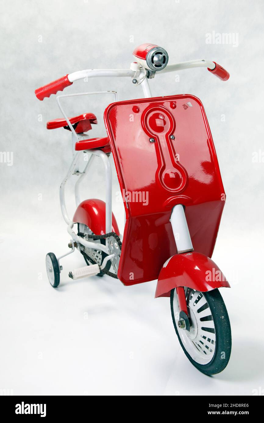 Antique Miniature Red Toy Diecast Tricycle Scooter With German Helmet On  Back Stock Photo - Download Image Now - iStock