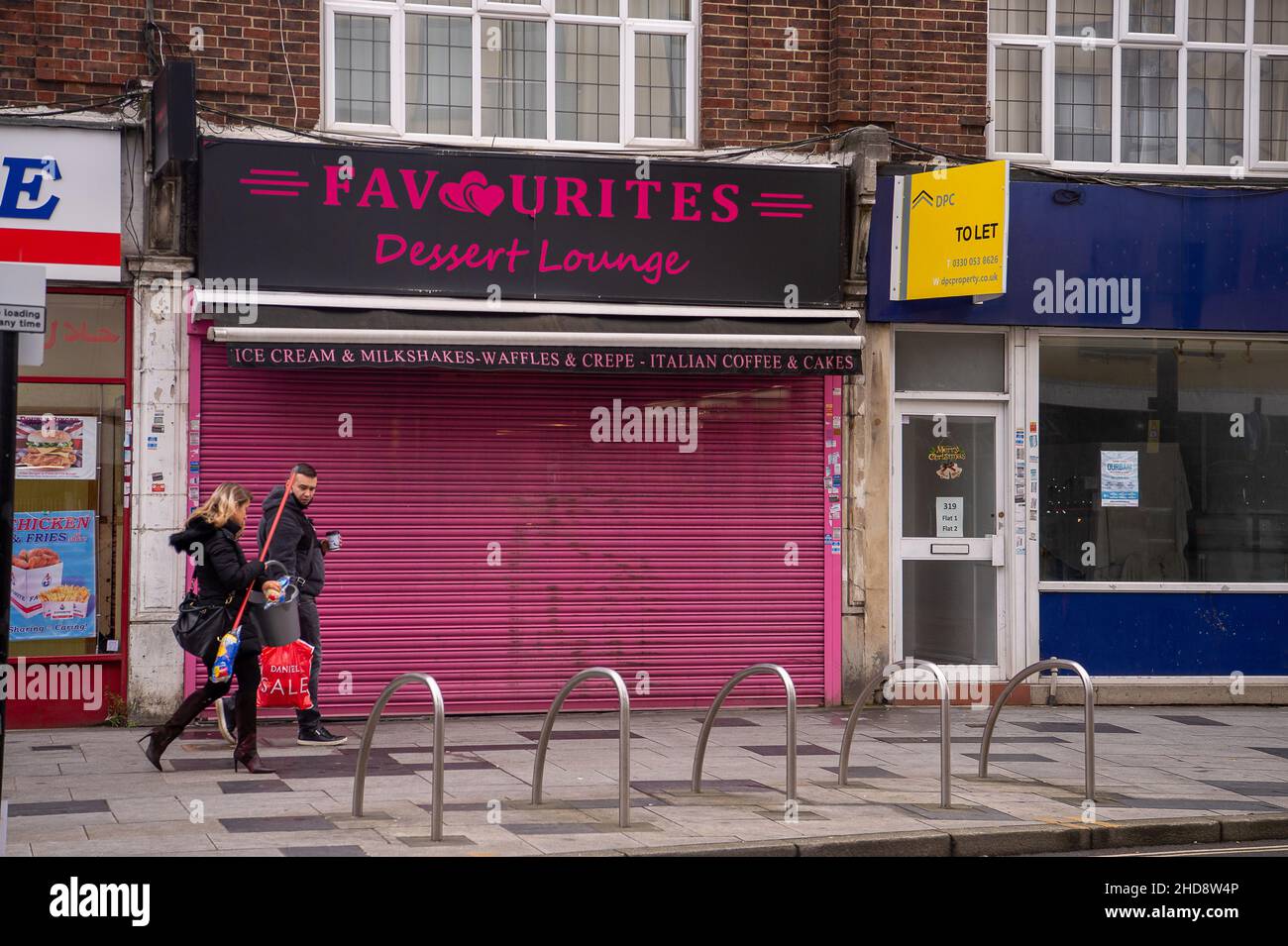Slough, Berkshire, UK. 30th  December, 2021. Shutters down at a cafe in Slough. Credit: Maureen McLean/Alamy Stock Photo