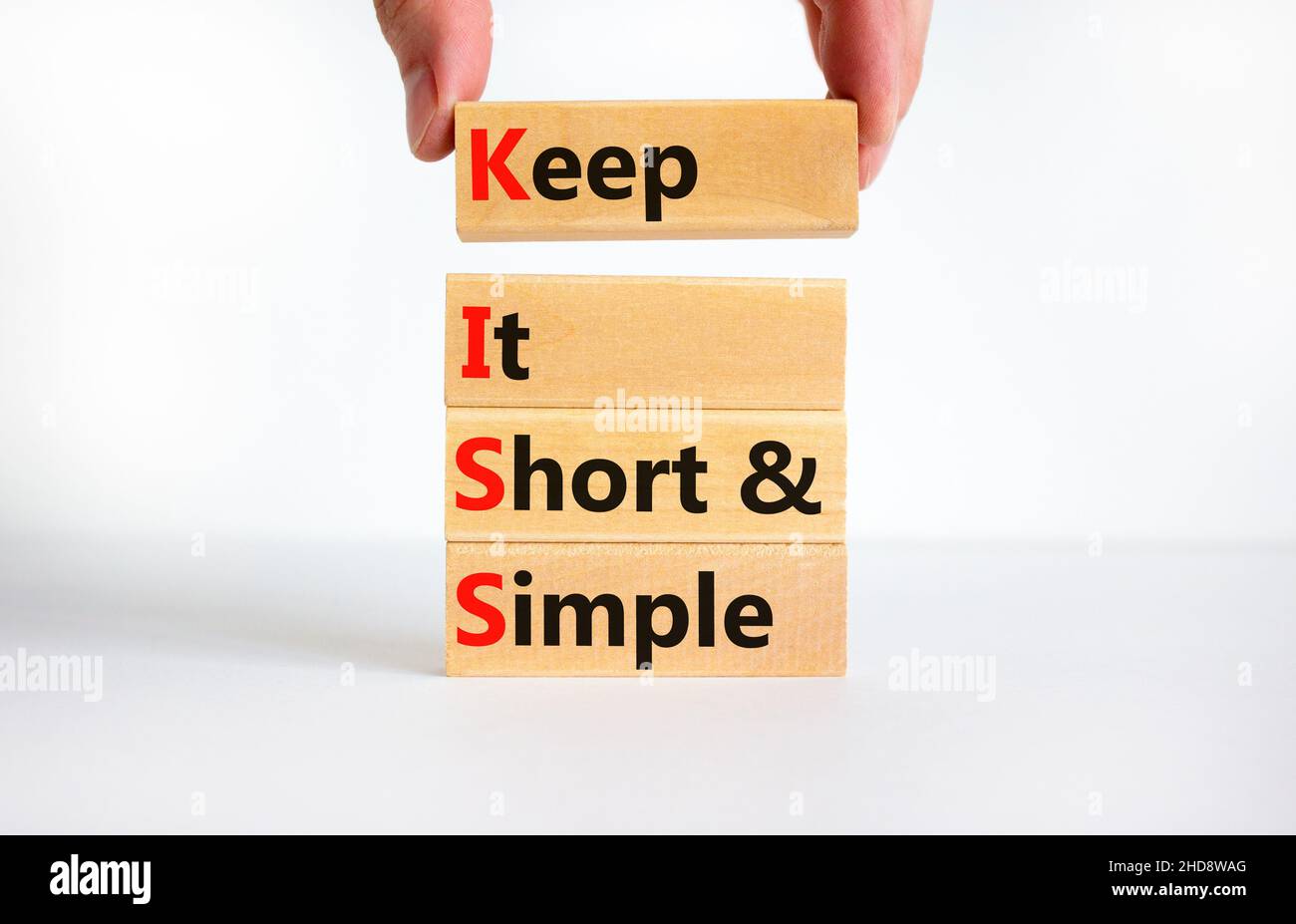 KISS keep it short and simple symbol. Concept words KISS keep it short and  simple wooden blocks. Beautiful white table, white background. Business KIS  Stock Photo - Alamy