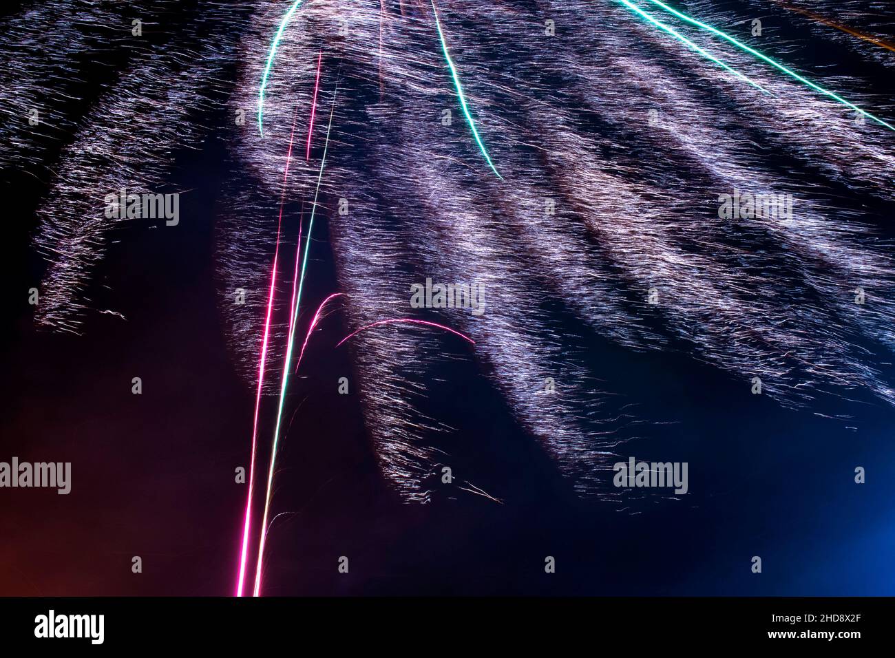 Dazzling firework exploding in the night sky Stock Photo - Alamy