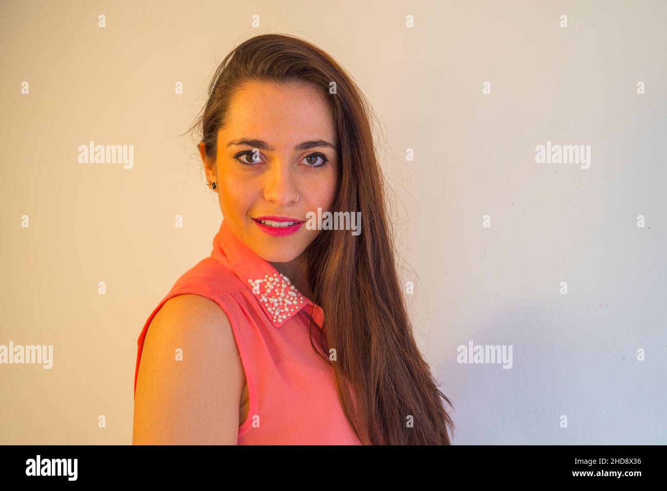 Young woman smiling and looking at the camera. Close view. Stock Photo