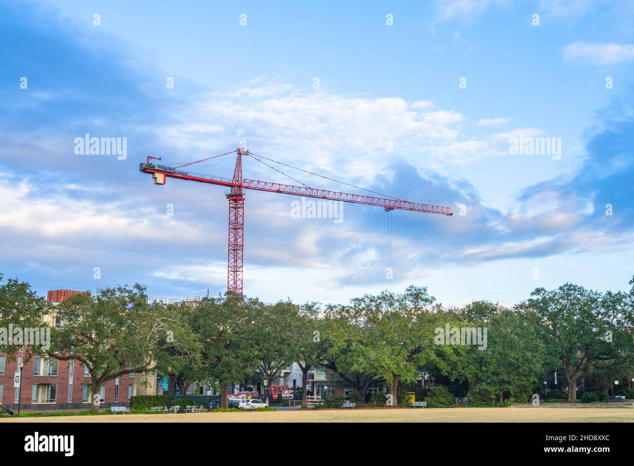 NEW ORLEANS, LA, USA - NOVEMBER 24, 2021: Cantilever crane with blue sky and clouds in the background over Tulane University campus Stock Photo