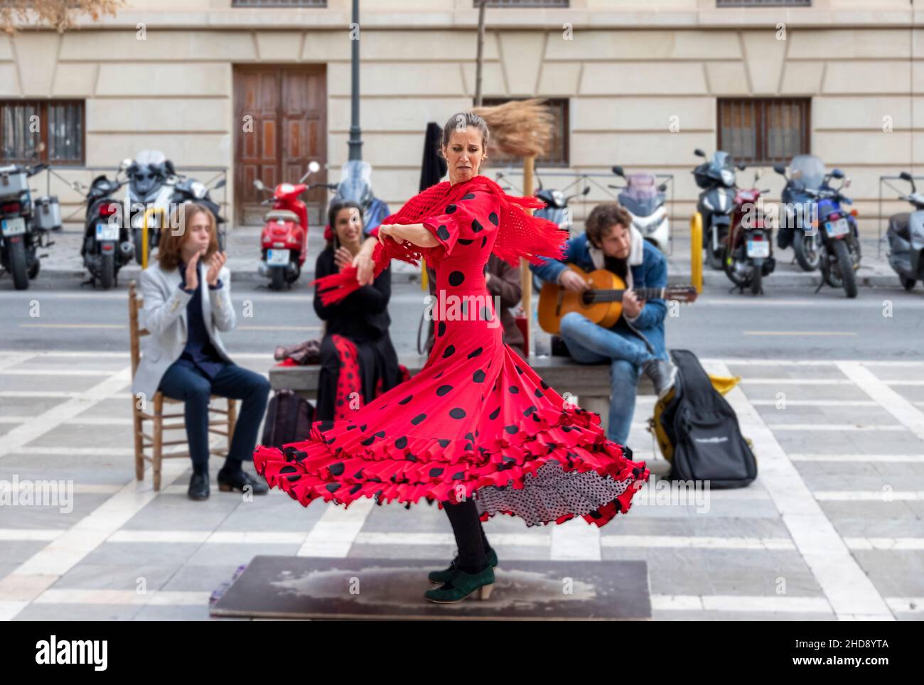 GRANADA ANDALUCIA SPAIN COLOURFUL FLAMENCO DANCER DANCING IN THE PLAZA DE SANTA ANA Stock Photo