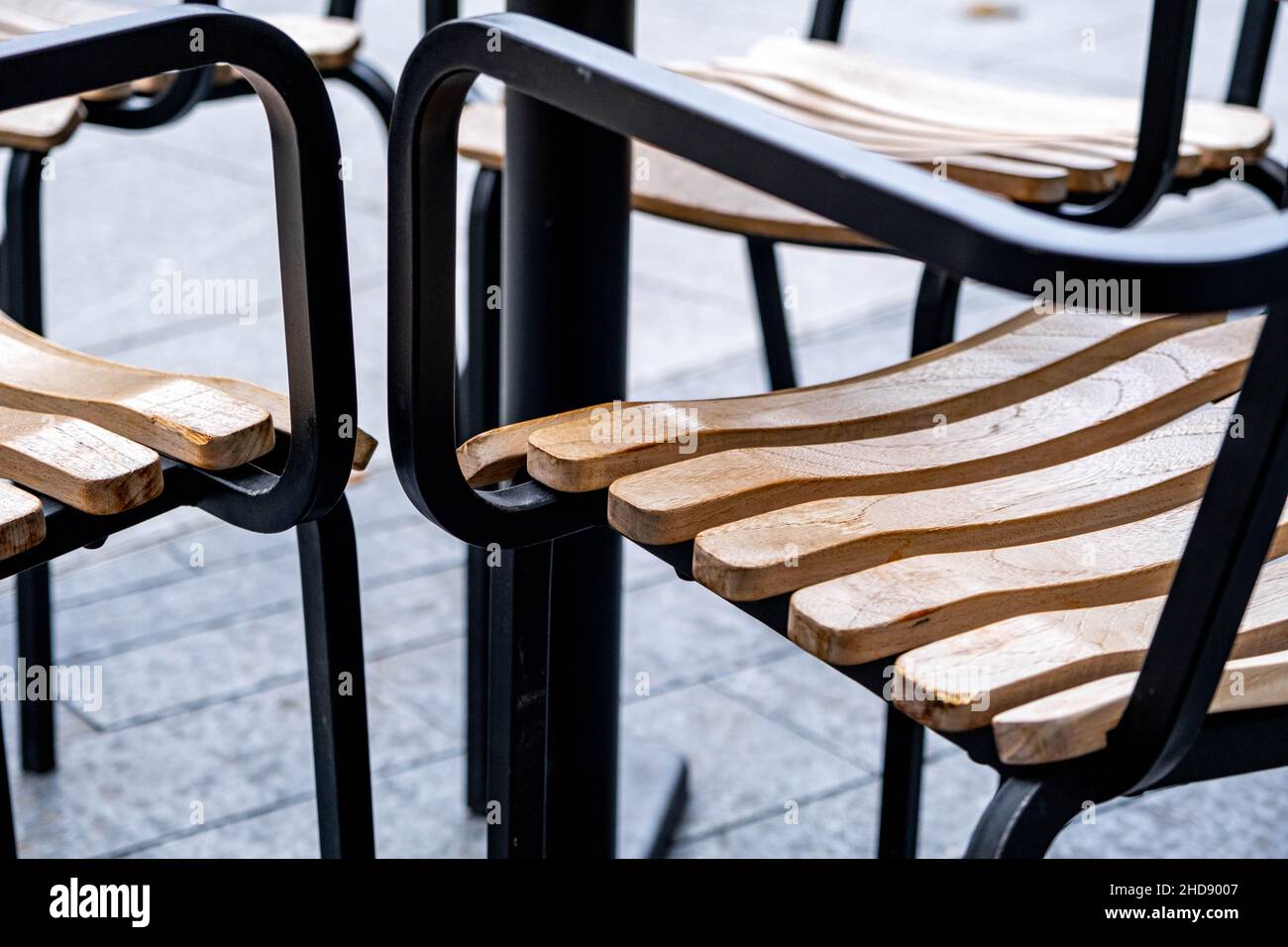 London England UK January 02 2022, Wooden Black Steel Frame Outside Seating Chairs With No People Stock Photo